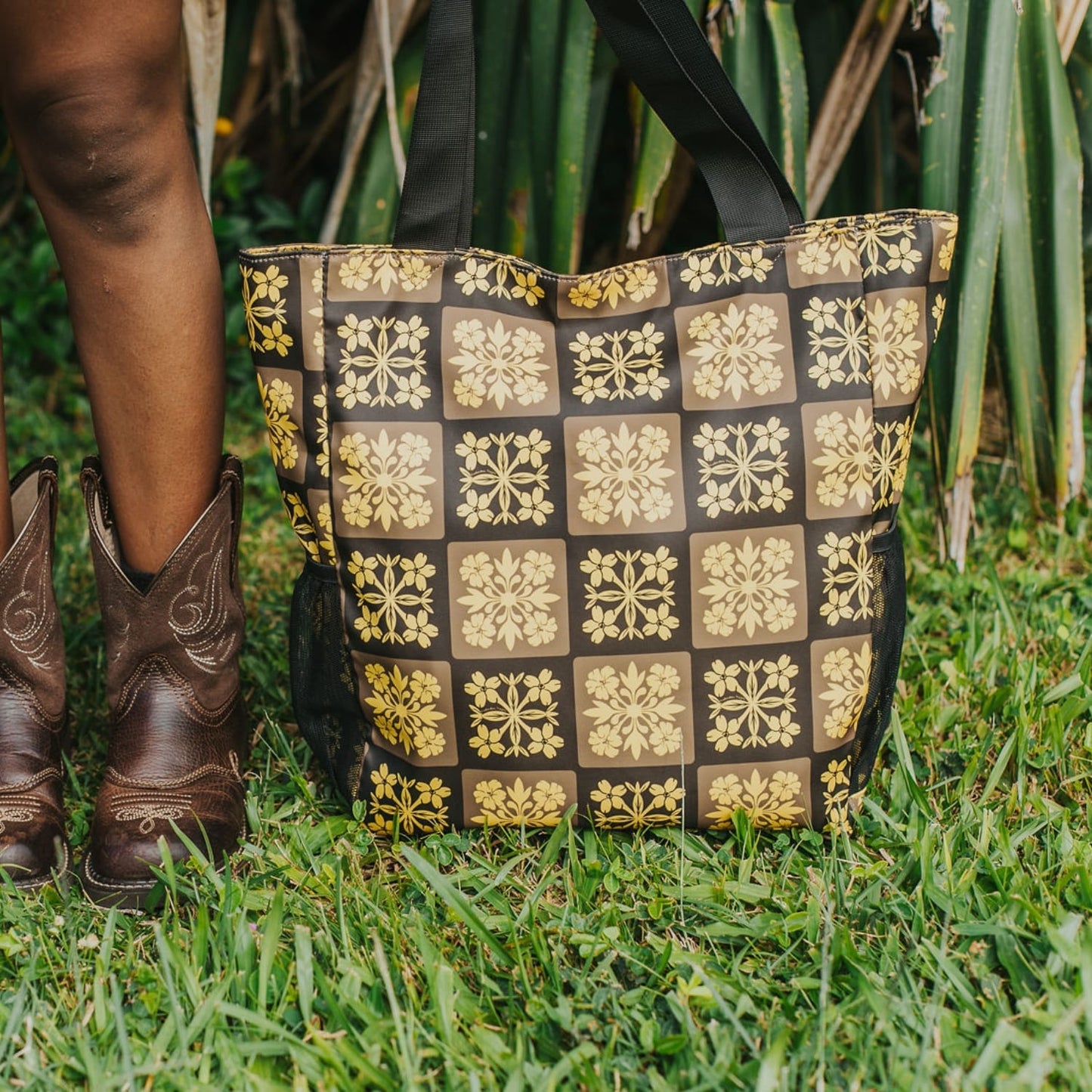 holoholo bag with pua kenikeni flowers - brown and yellow from Puakenikeni Designs front view by model