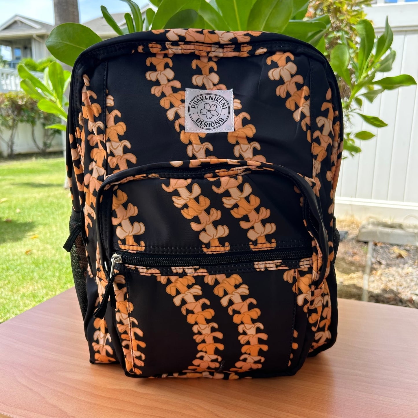 Backpack by Puakenikeni Designs, in the best selling and favorite pua kenikeni lei design, Kaulua, front view