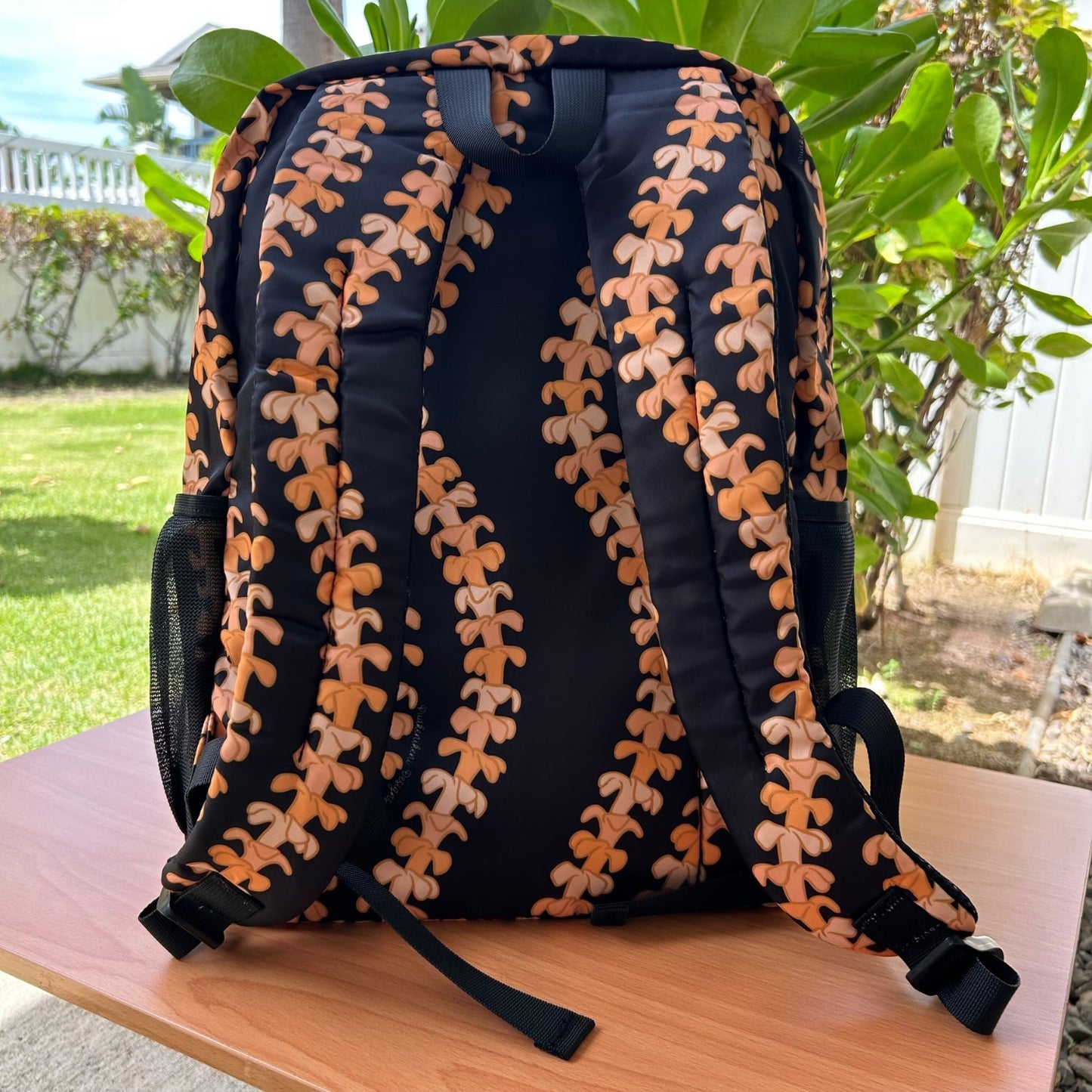 Backpack by Puakenikeni Designs, in the best selling and favorite pua kenikeni lei design, Kaulua, back view