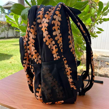 Backpack by Puakenikeni Designs, in the best selling and favorite pua kenikeni lei design, Kaulua, side view