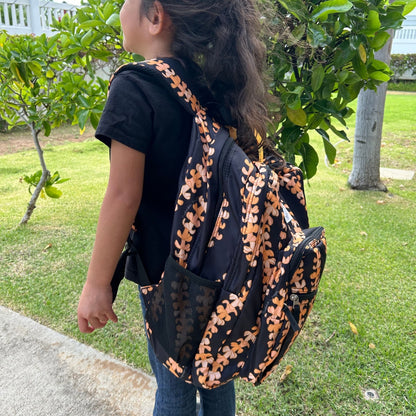 Backpack by Puakenikeni Designs, in the best selling and favorite pua kenikeni lei design, Kaulua, on small child model