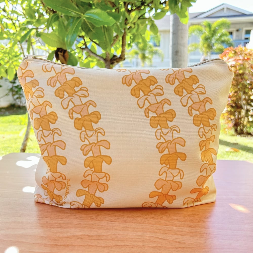 large canvas zippered pouch - beige with pua kenikeni lei from Puakenikeni Designs front view
