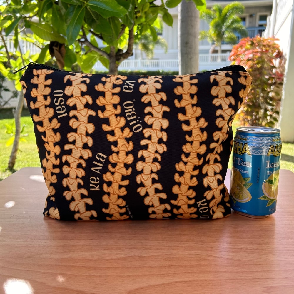 large canvas zippered pouch with pua kenikeni lei - Christian, faith, Jesus by Puakenikeni Designs view next to juice can