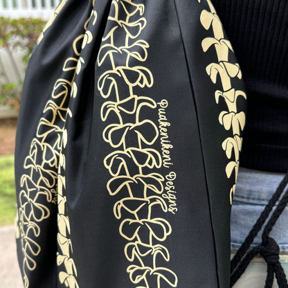 cinch drawstring backpack with pua kenikeni lei from Puakenikeni Designs closeup of design