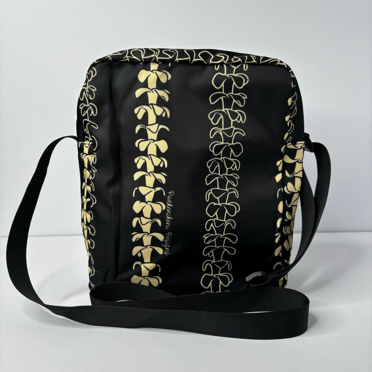 Crossbody bag by Puakenikeni Designs, in black with the best-selling pua kenikeni lei design, Kaulua; for women, moms, teenage girls, for travel and school Beige Lei Design back view