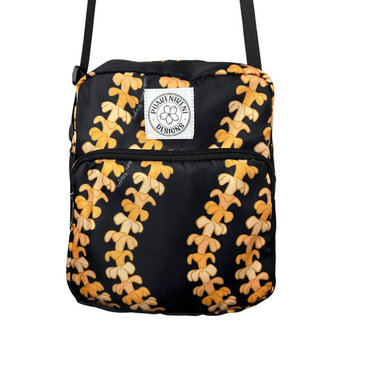 Crossbody bag by Puakenikeni Designs, in black with the best-selling pua kenikeni lei design, Kaulua; for women, moms, teenage girls, for travel and school