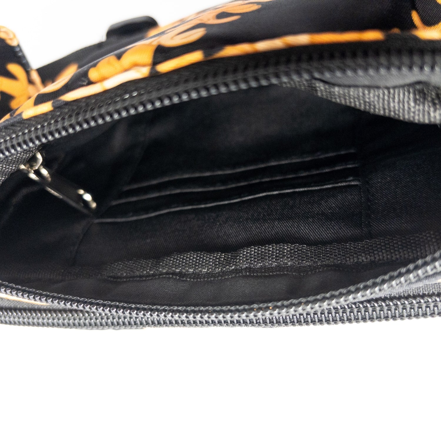 fanny pack, waist bag, belt bag, chest bag, hip pack, crossbody in orange pua kenikeni lei on black from Puakenikeni Designs top view inside 3 card slots
