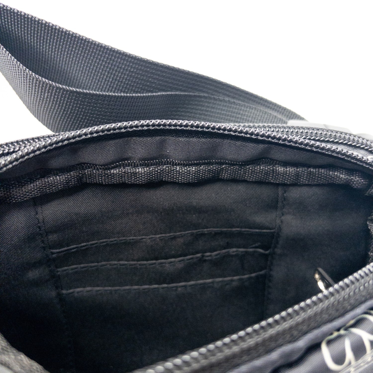 fanny pack, waist bag, belt bag, chest bag, hip pack, crossbody in pua kenikeni lei on black from Puakenikeni Designs top view 3 card slots