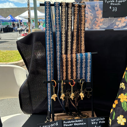 puakenikeni lei lanyard in blue from Puakenikeni Designs display at What the Truck event at Waikele Center