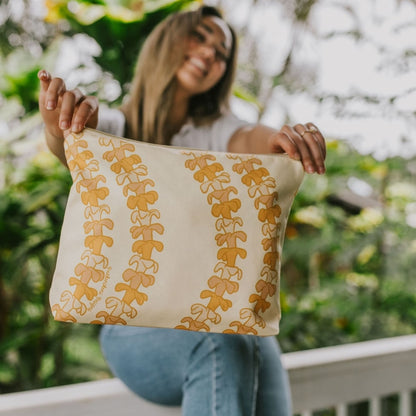 large canvas zipper pouch - beige with pua kenikeni lei from Puakenikeni Designs - model holding