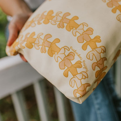 large canvas zippered pouch - beige with pua kenikeni lei from Puakenikeni Designs close-up