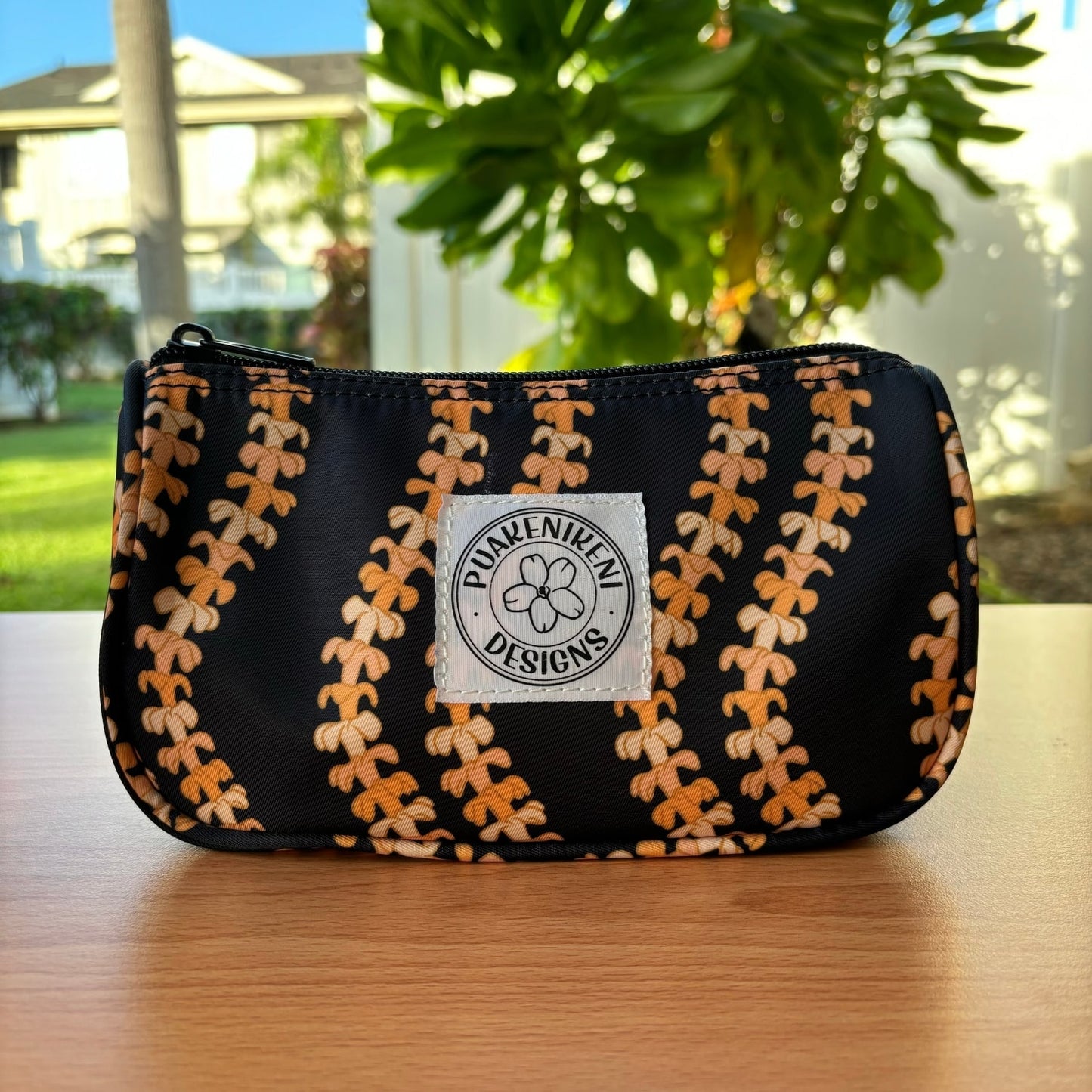 grab and go set includes mini zipper pouch and wristlet key fob in kaulua black orange lei - from Puakenikeni Designs - front view of mini zipper pouch