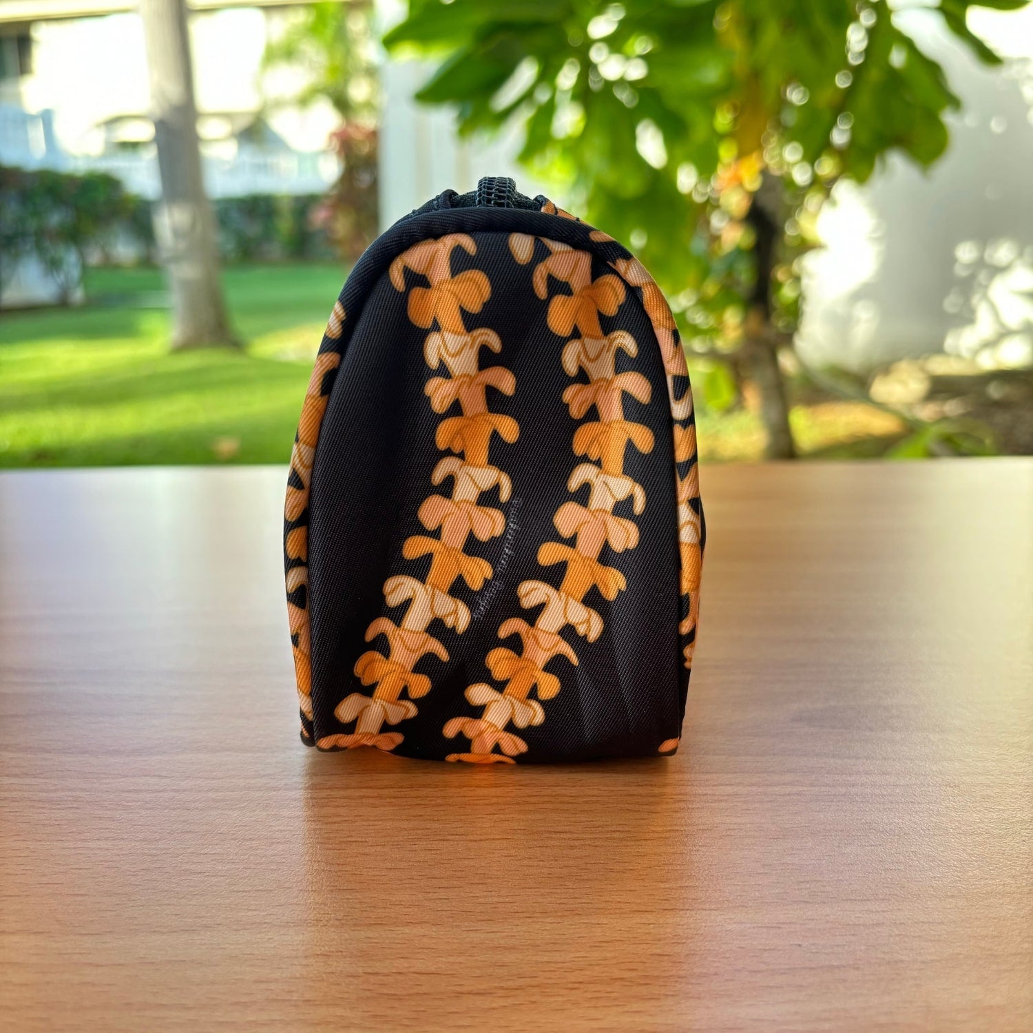 grab and go set includes mini zipper pouch and wristlet key fob in kaulua black orange lei - from Puakenikeni Designs - side view of mini zipper pouch