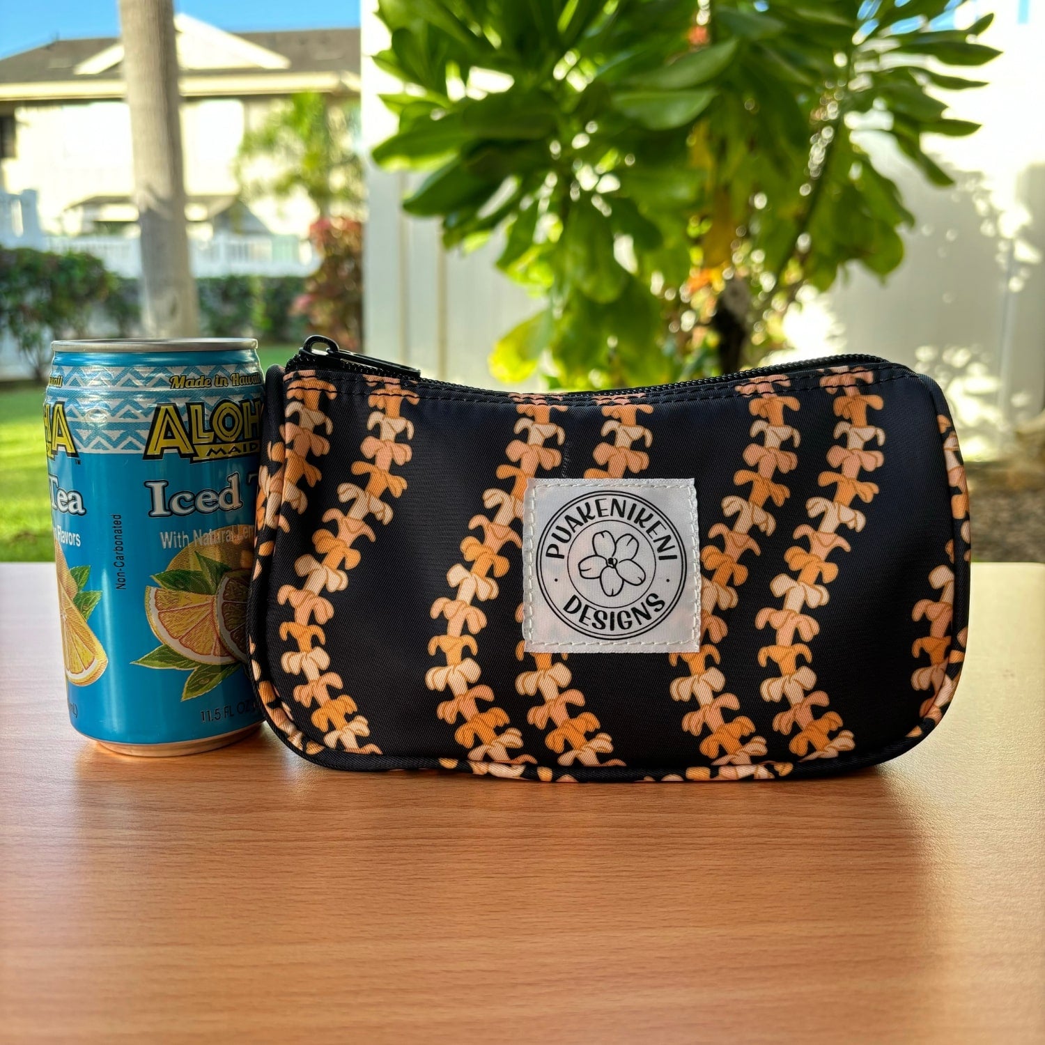 Mini Zipper Pouch - make-up bag, clutch, wristlet, with puakenikeni lei design from Puakenikeni Designs next to juice can