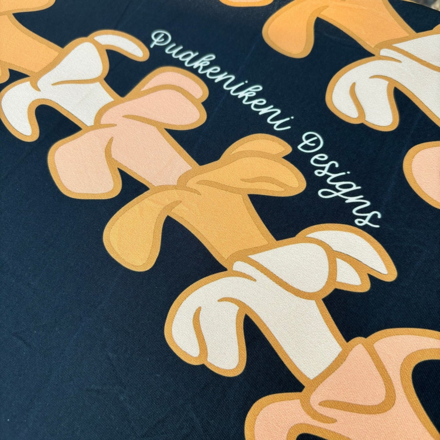 pua kenikeni lei table covers for party, with elastic, tablecloth, fitted for 6 foot table, rectangle - Kaulua Black - from Puakenikeni Designs close up view