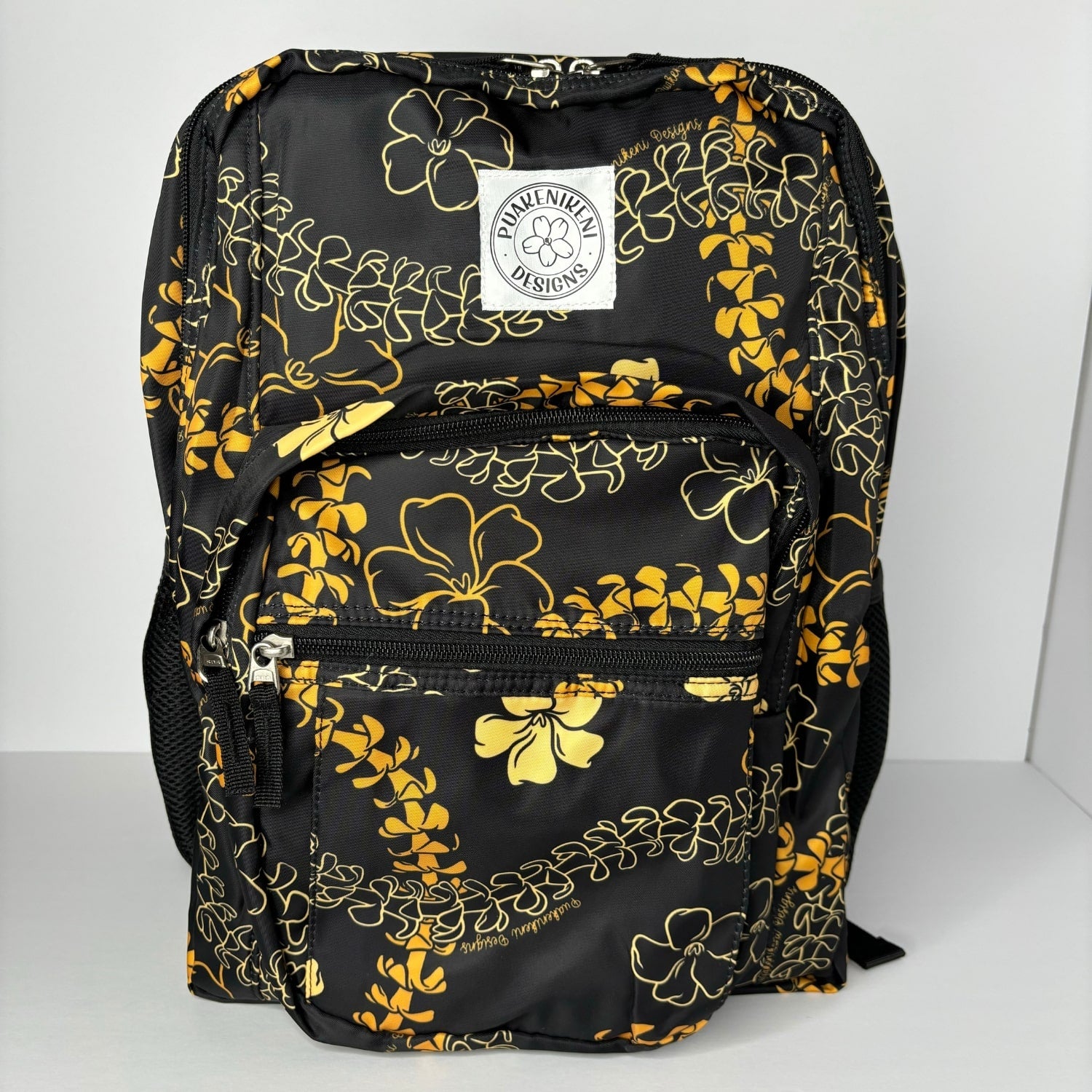 backpack for school, travel, diaper bag, with pua kenikeni lei, black and orange from Puakenikeni Designs