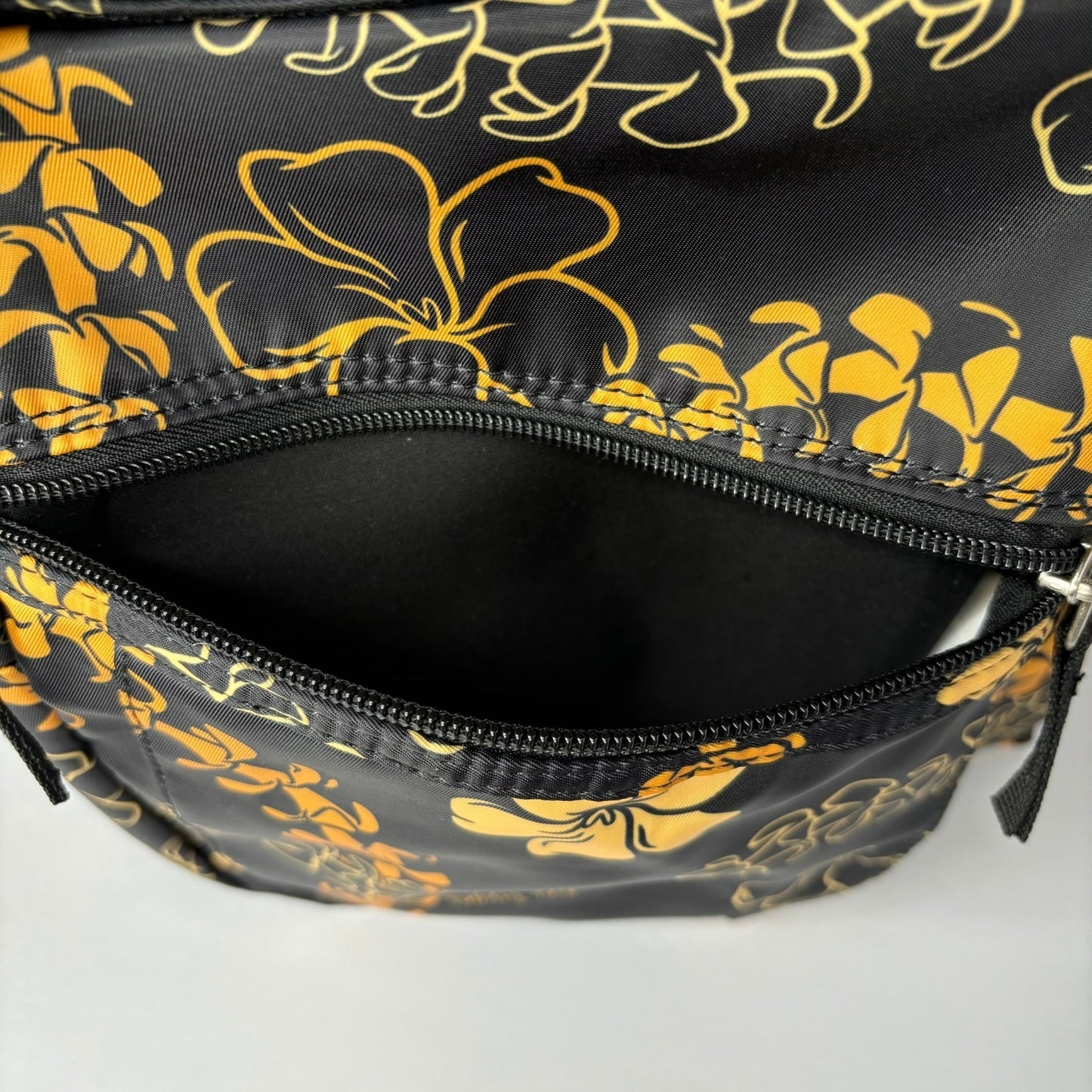 backpack for school, travel, diaper bag, with pua kenikeni lei, black and orange from Puakenikeni Designs very front pocket