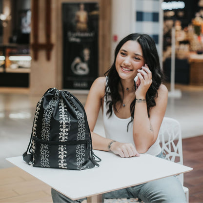 cinch drawstring backpack with pua kenikeni lei from Puakenikeni Designs Beige Lei on table