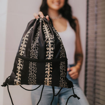 cinch drawstring backpack with pua kenikeni lei from Puakenikeni Designs Beige Lei model holding