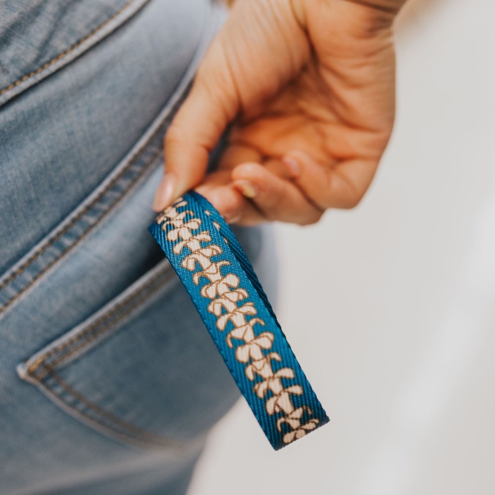 pua kenikeni lei wristlet key fob - hawaiian keychain - blue - from Puakenikeni Designs - close-up in back pocket