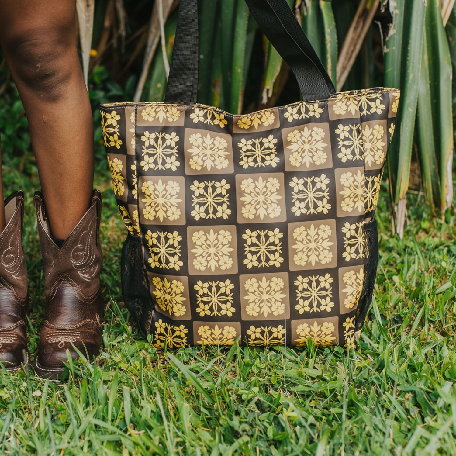 holoholo bag with pua kenikeni flowers - brown and yellow from Puakenikeni Designs front view by model