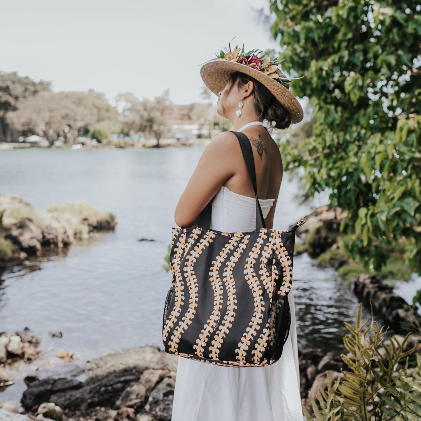 Holoholo bag with pua kenikeni lei in Kaulua by Puakenikeni Designs - Made for Hawaii Pua kenikeni tote bag on shoulder of model