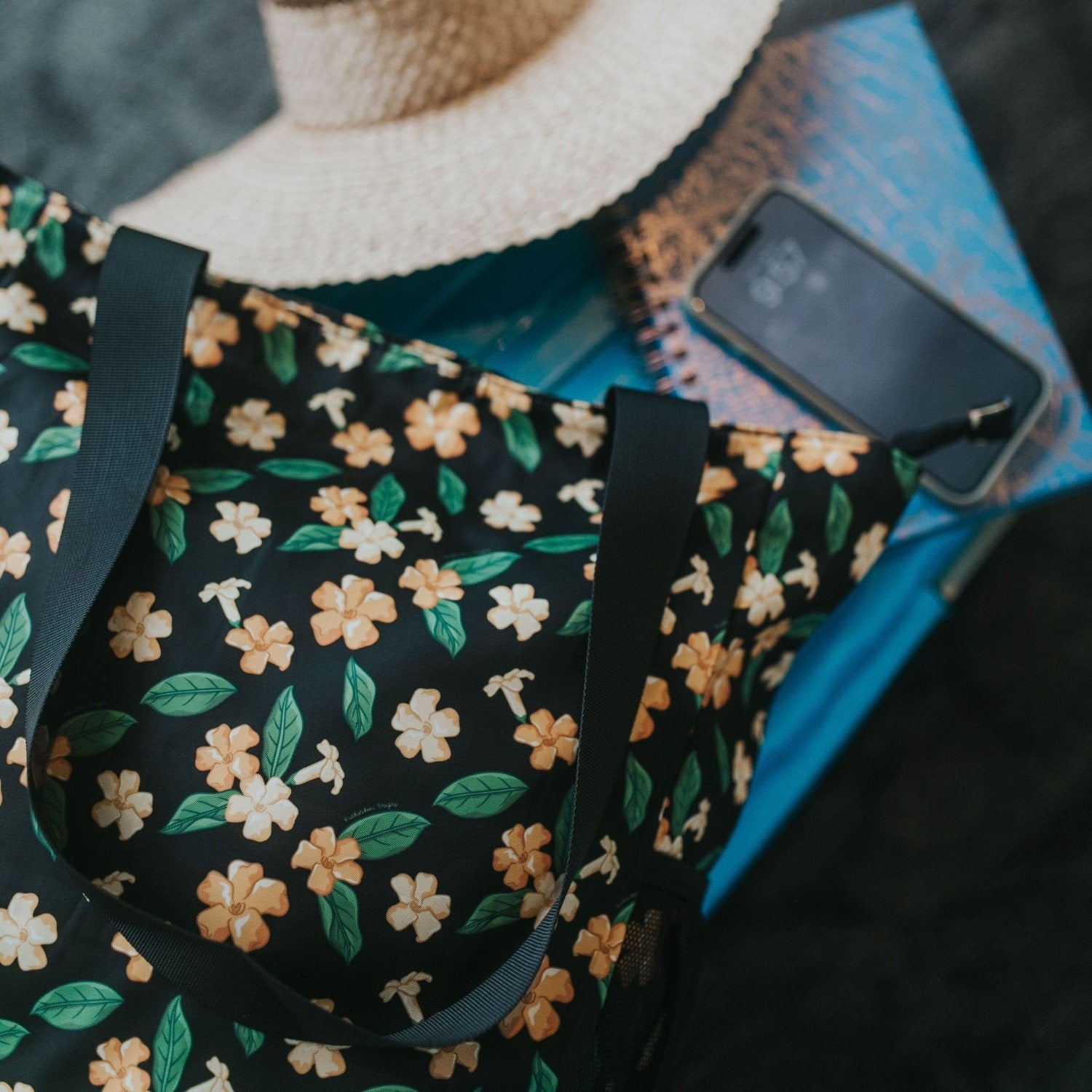 Holoholo bag with pua kenikeni flowers and leaves from Puakenikeni Designs flat lay