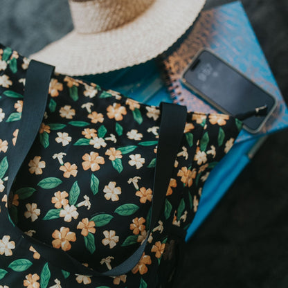 Holoholo bag with pua kenikeni flowers and leaves from Puakenikeni Designs flat lay