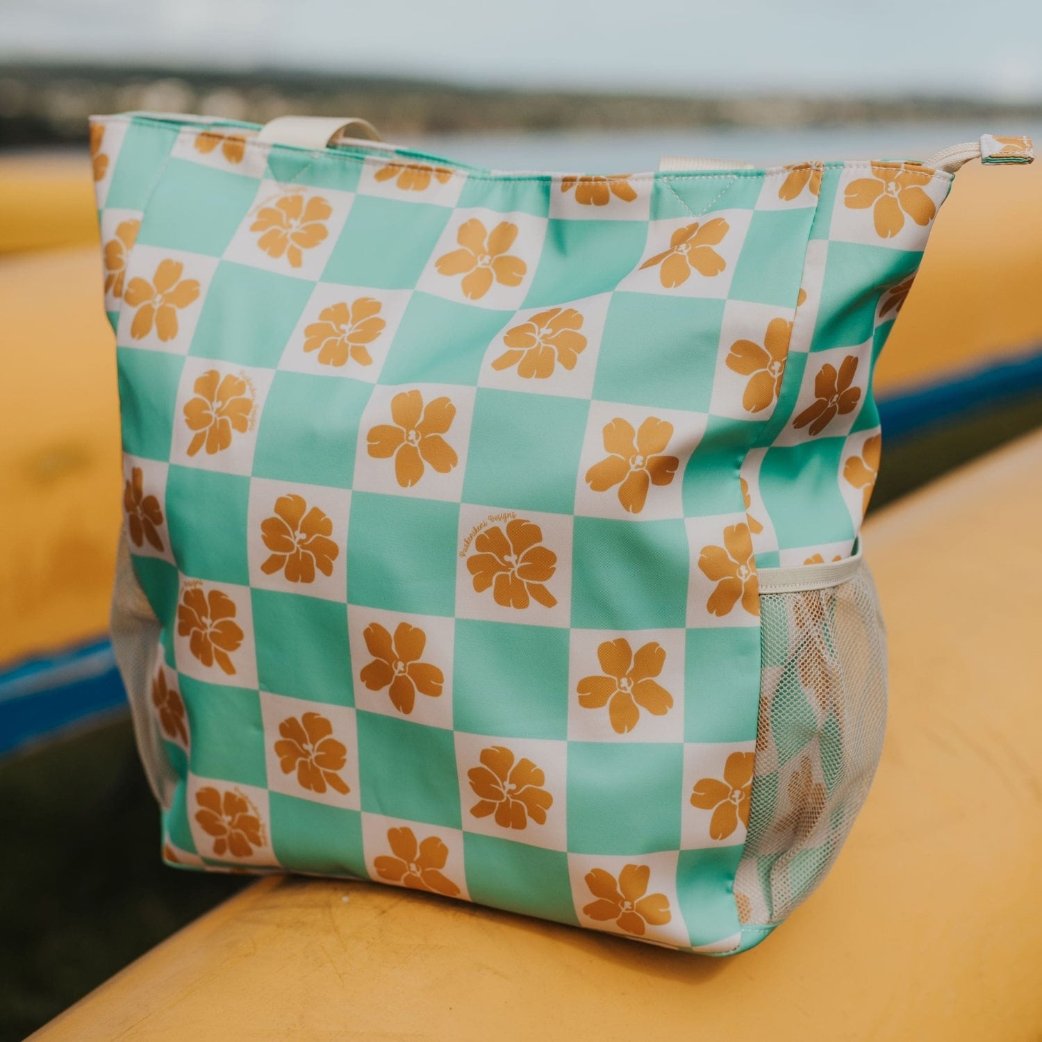 puakenikeni holoholo bag in turquoise checker from Puakenikeni Designs on canoe