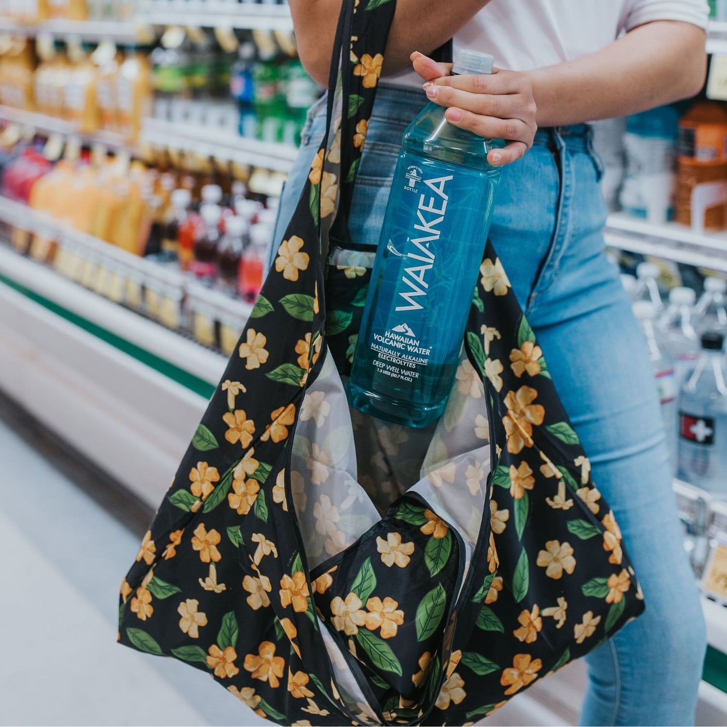 large foldable reusable shopping bag with puakenikeni flowers and leaves from Puakenikeni Designs - close-up grocery